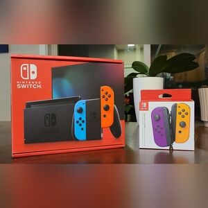 Nintendo Switch with Neon Blue & Neon Orange Joy‑Con and Purple/Yellow Set